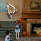 Zala holds a balloon during her fourth birthday party.
